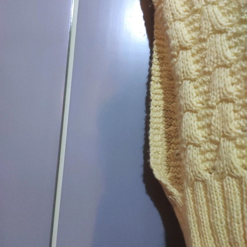 Sleeveless knitted vest used with pattern yellow pale