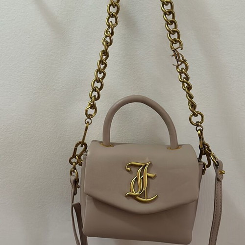 Juicy Couture small crossbody bag nude color with gold design like new