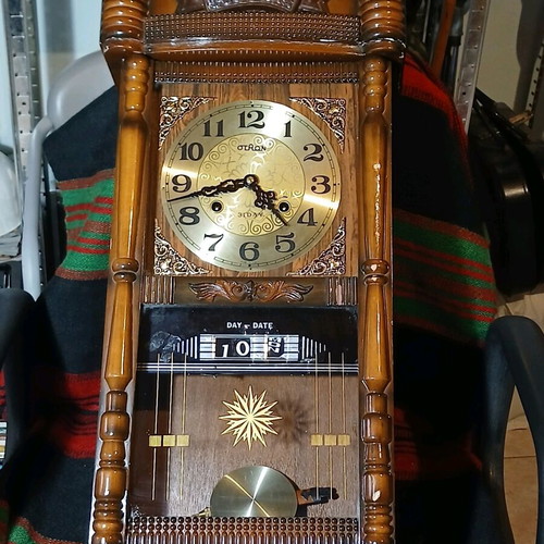 Vintage wooden wall clock with pendulum used, eagle decoration