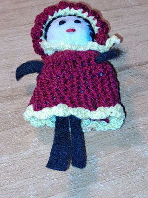 Knitted doll used, as shown