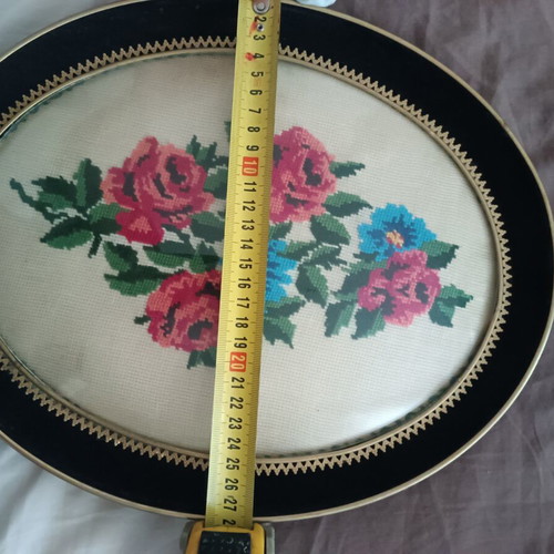 Vintage handmade cross-stitch frame with velvet oval border used