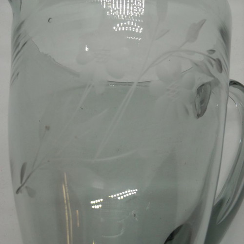 Vintage water pitcher made of blown glass used, gray with floral engravings
