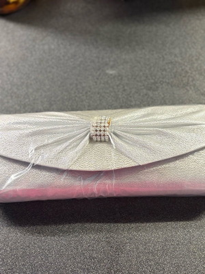 Evening bag new, silver color handheld