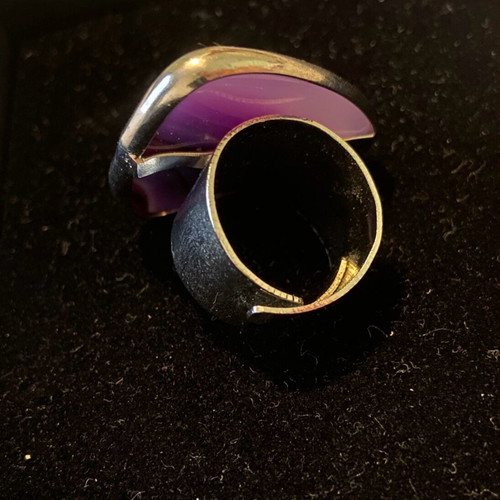 Handmade ring with steel setting and purple stone appearance like new