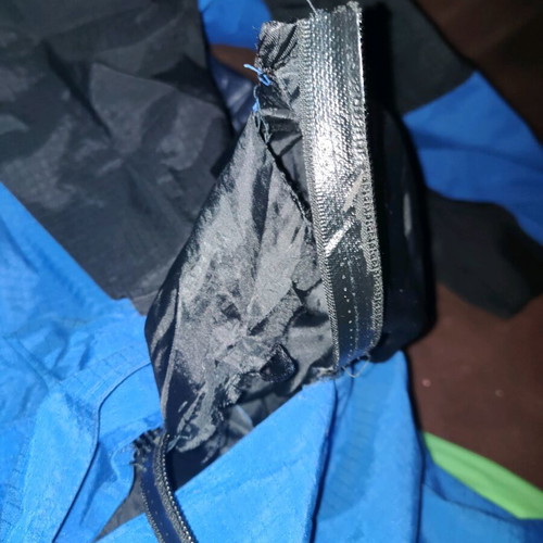 The North Face men's jacket used blue and black waterproof windbreaker