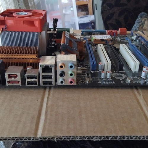 Asus M4A79T Deluxe motherboard used with CPU, fan and 16GB RAM