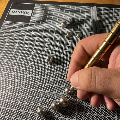 Gold Fidget Pen used with magnetic parts and two ink refills