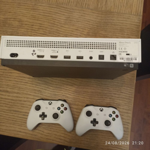 Xbox One S console with two controllers