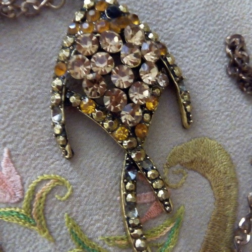 Fish pendant used with zircon and gold-colored chain