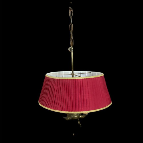 Vintage brass ceiling light with three lamps and red shade used