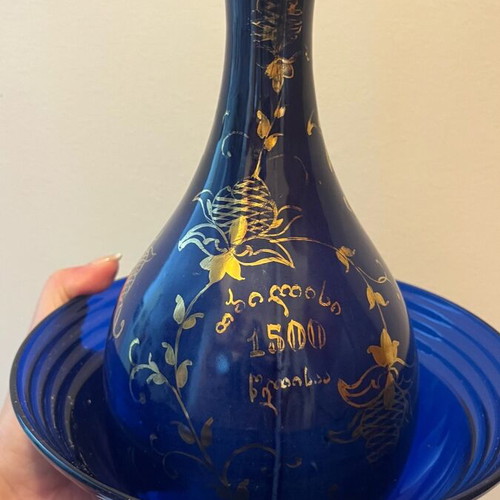 Decorative bottle used, blue glass with gold details
