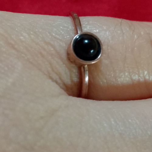Ring with black stone in copper color, like new, inner diameter 16