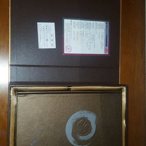 Collectible Chinese book like new with gilded coin and certificate