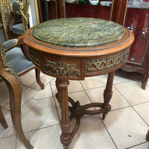 Table with bronze details and marble top used