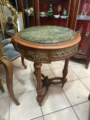 Table with bronze details and marble top used