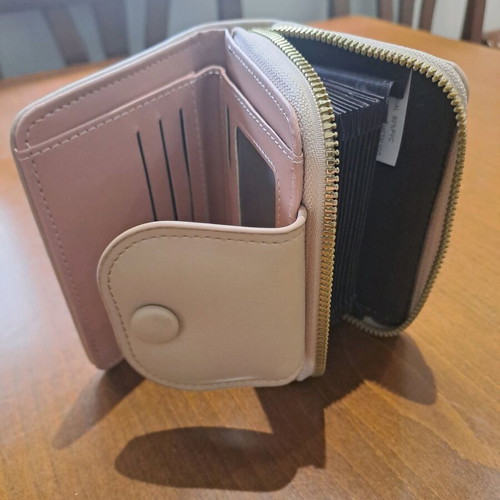Beige wallet like new with zipper and card slots