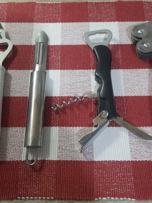 Kitchen tools like new, set with opener, vegetable peeler, multi-opener and sharpener