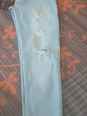 Women's turquoise denim jeans used, size 28, with distressed detail