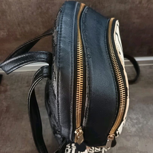 Guess backpack used with leather cracks