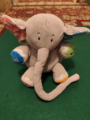 Interactive plush elephant toy with stories and songs