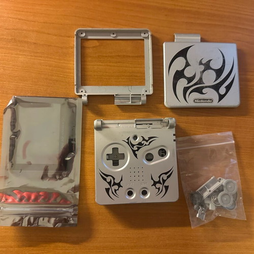 Game Boy Advance SP plastic parts used, moderate condition