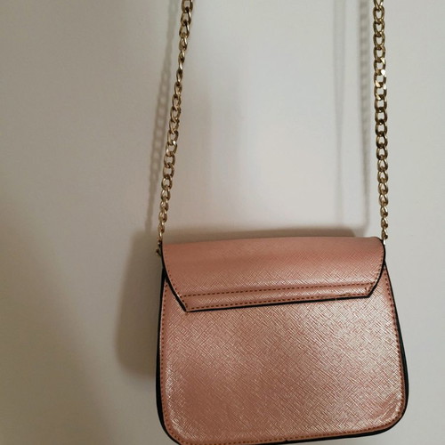 Shoulder bag new in pink-gold color with gold strap