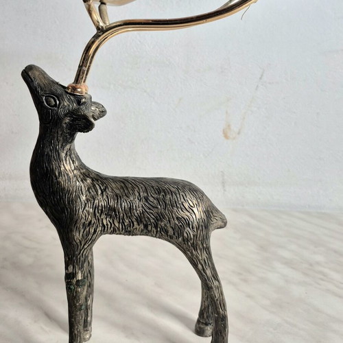 Vintage metal deer-shaped candle holder used