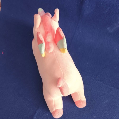 Pink plush unicorn with colorful wings