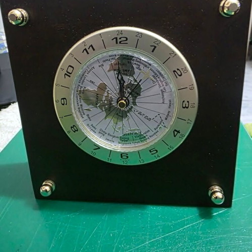 Luxury analog desk clock with world map and airplane needle