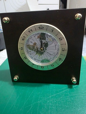 Luxury analog desk clock with world map and airplane needle