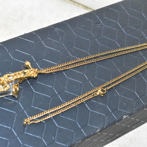 Swarovski necklace with saxophone pendant and crystal like new, gold plated