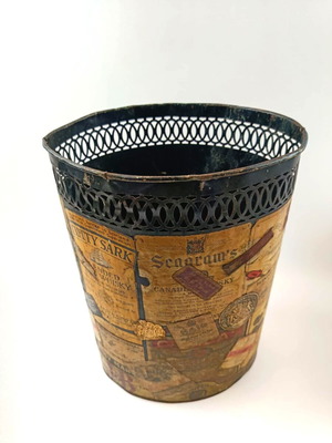 Vintage metal umbrella stand used with collage of old drink labels