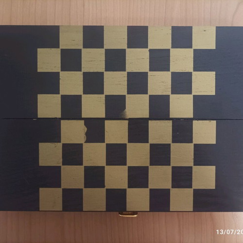 Wooden wine case used with travel chess set