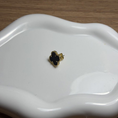 Steel earring black and gold, like new, single piece