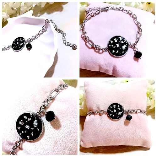 Handmade steel bracelet with iridescent black motif and silver flakes