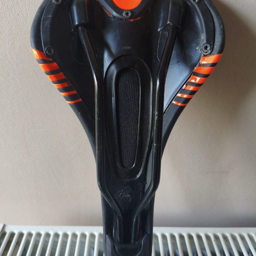 Bicycle saddle for MTB used, 300 grams, slight tear on right side