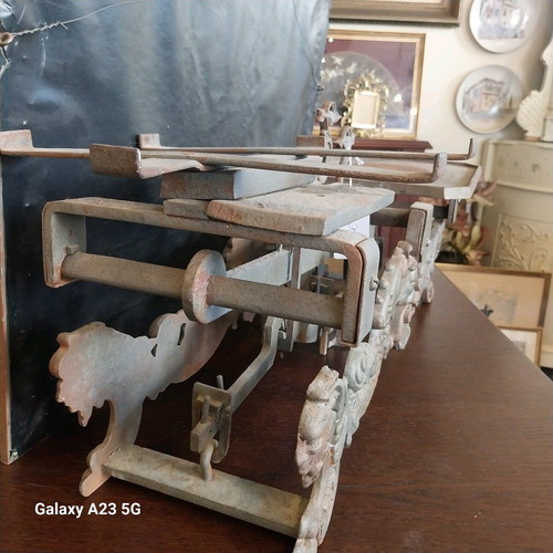 Cast iron antique scale used with lion and dragon decorations