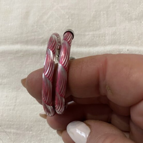 Hoop earrings like new with pink and silver embossed design