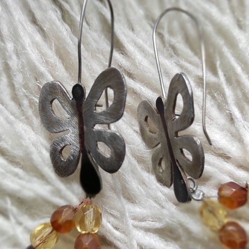 Silver butterfly earrings used with citrine stones