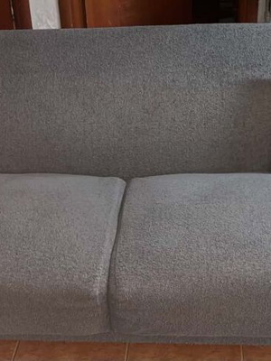 Two-seater sofa gray like new with wooden legs and recliner gift