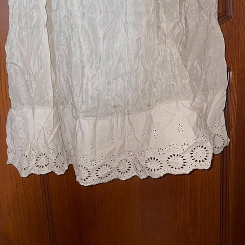 Long beige strapless dress used with honeycomb detail and neck tie