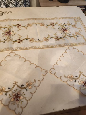 Set of three embroidered organza table linens with floral motifs
