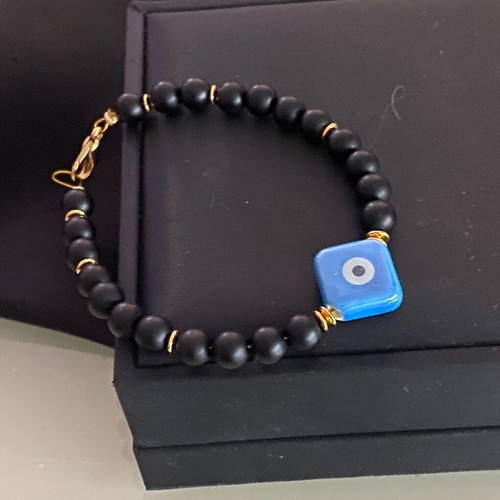 Handmade bracelet with haolite semi-precious stones and ceramic eye motif