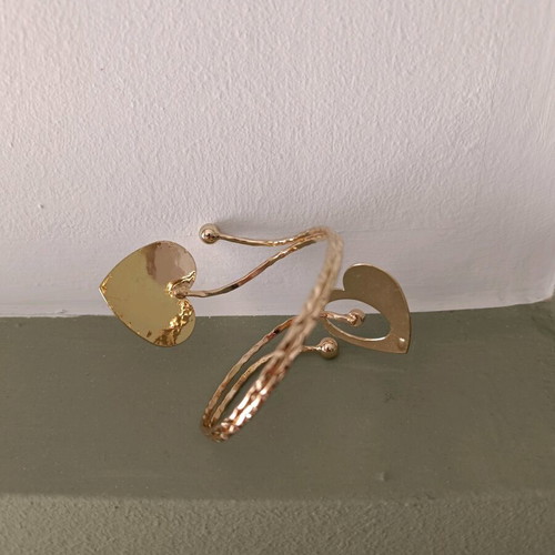 Cuff bracelet used with 2 gold-tone hearts
