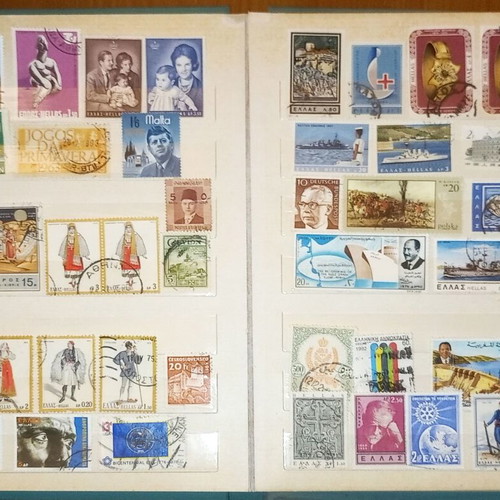Book with collection of various Greek and foreign stamps used