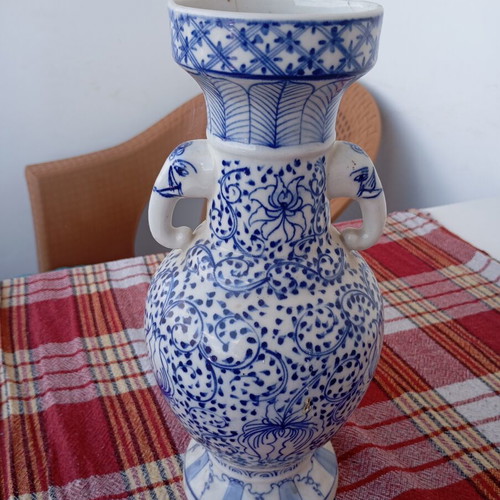 Vintage porcelain vase used, traditional Asian style blue and white Ming Qing design