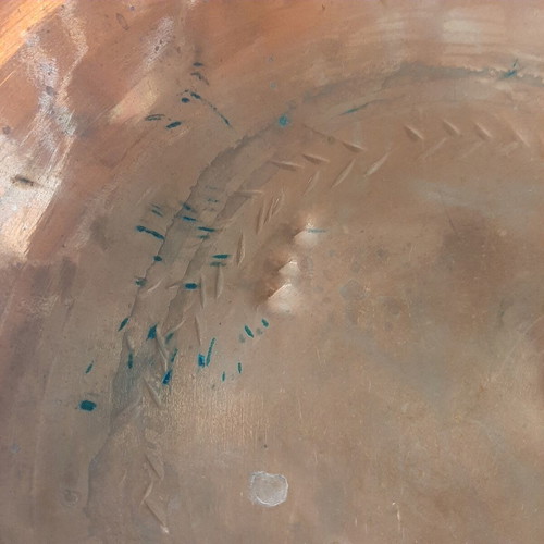 Large copper bowl used with carved details