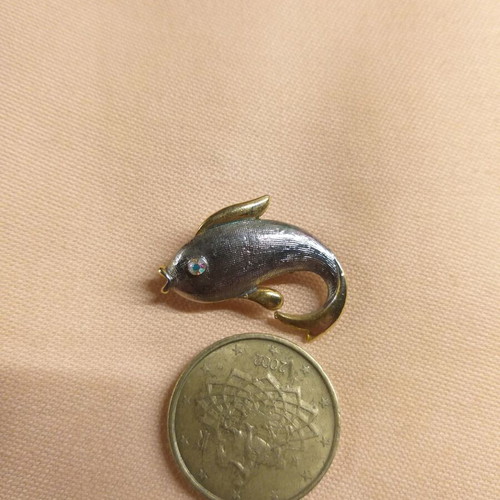 Dolphin pin used, silver and gold color