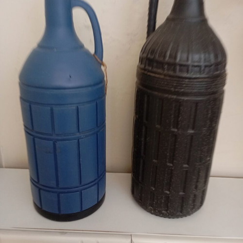 Glass bottles set of 2 used, one with moisture marks