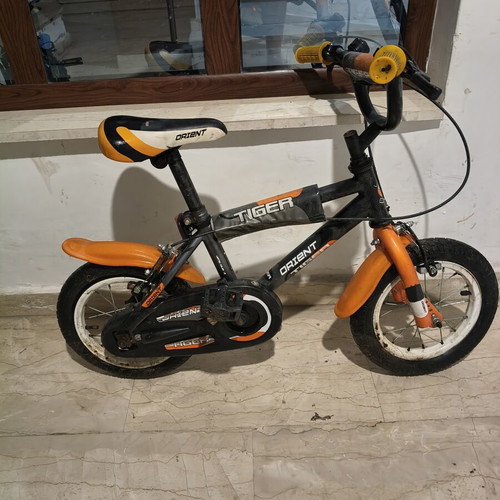 Tiger 12" children's bike used, orange Orient, needs rear tube